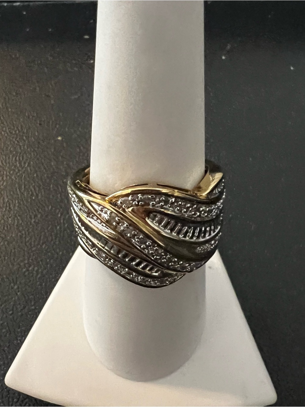 Gold and Silver Braided Multi-Row Women's quarter carat diamond ring.